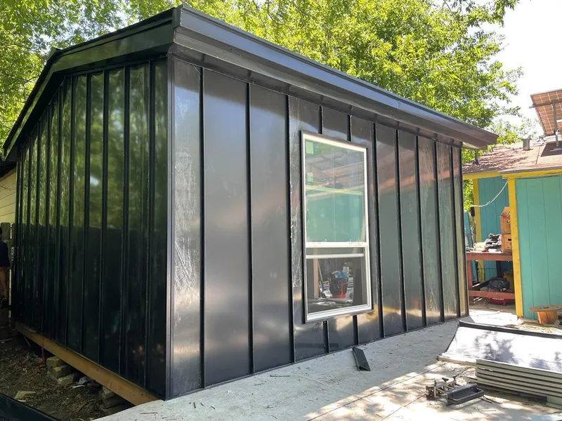 Black standing seam metal wall panels for Roof Inspection in Draper